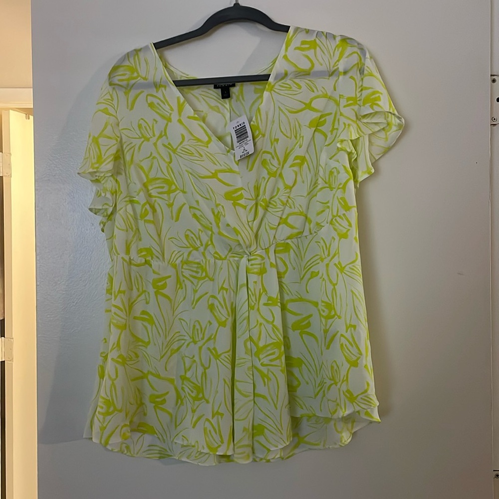 Beautiful peplum style blouse from Torrid. NWT